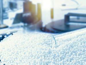 picture of overturned test tube spilling plastic beads