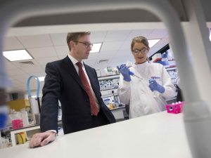Prof Quentin Anstee of Newcastle University with a lab technician in a lab