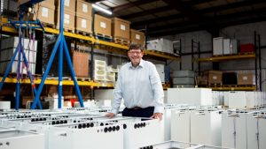 Andrew Bissell, founder and CEO, Sunamp in a factory with heat batteries