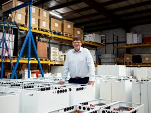Andrew Bissell, founder and CEO, Sunamp in a factory with heat batteries